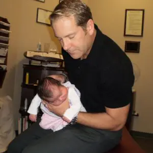 Chiropractor Naperville IL Timothy Erickson with Child