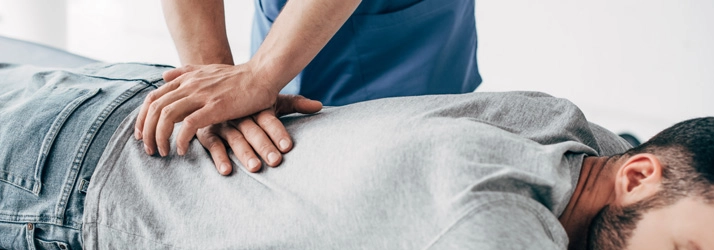 Chiropractic Naperville IL Chiropractic Adjustment Chiropractor adjusting a patient.